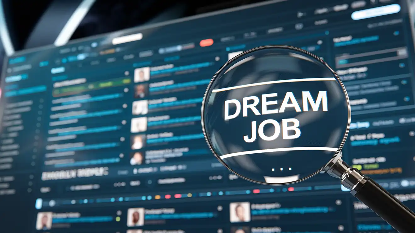 Screen with magnifying glass showcasing a DREAM JOB