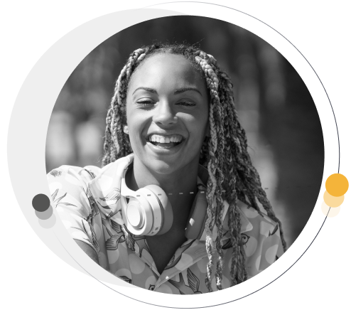 happy woman with headphones around neck smiling