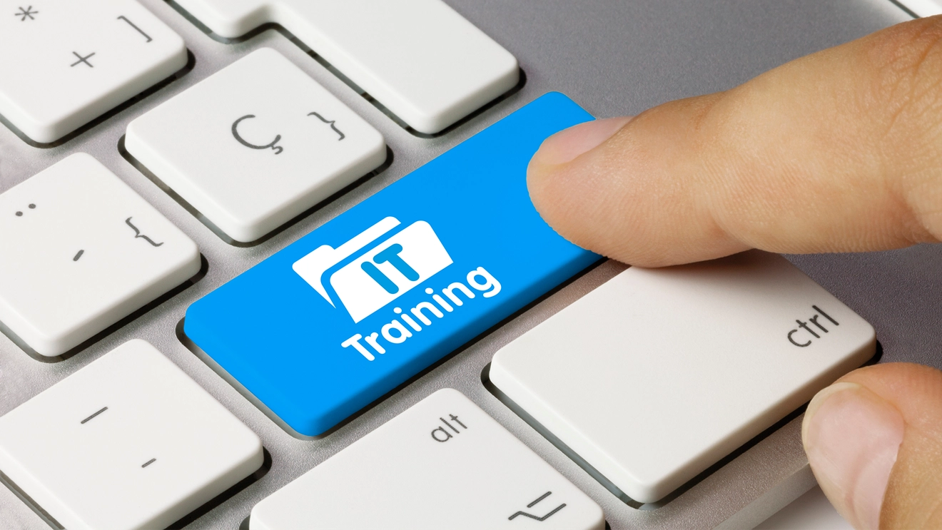keyboard with blue key that says IT Training