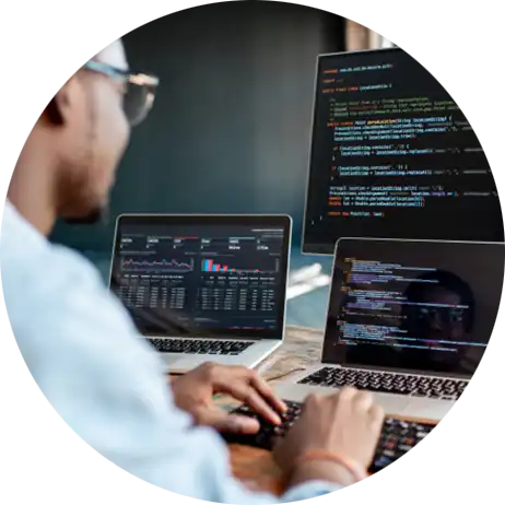 Man coding on a laptop