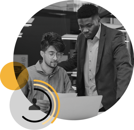 Two men looking at computer together