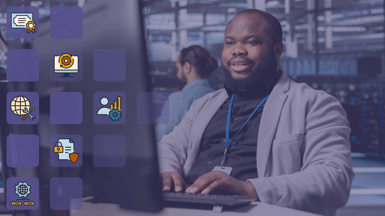 An image of a man working in IT on a laptop, with graphics floating in front.