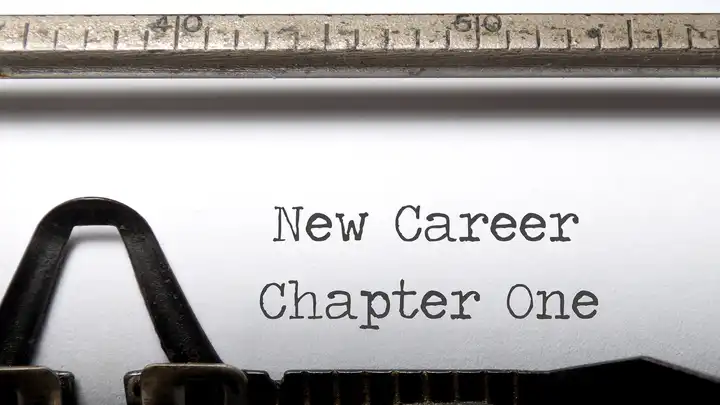 typewriter with type that says New career Chapter one