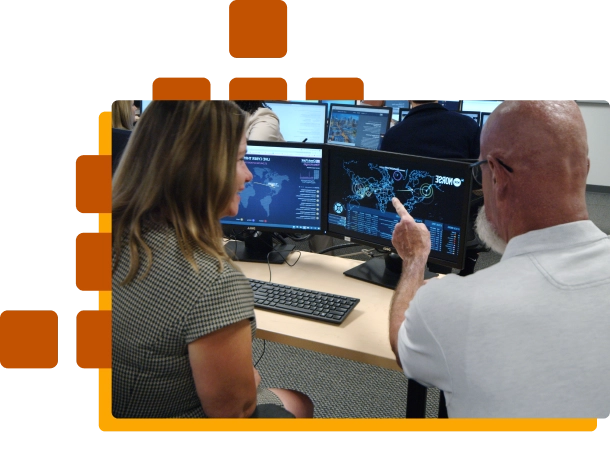 instructor showing student on computer